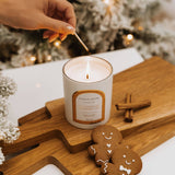 Caitlin Louise Collection Christmas Candle Gingerbread Wonderland - hand lighting candle with match