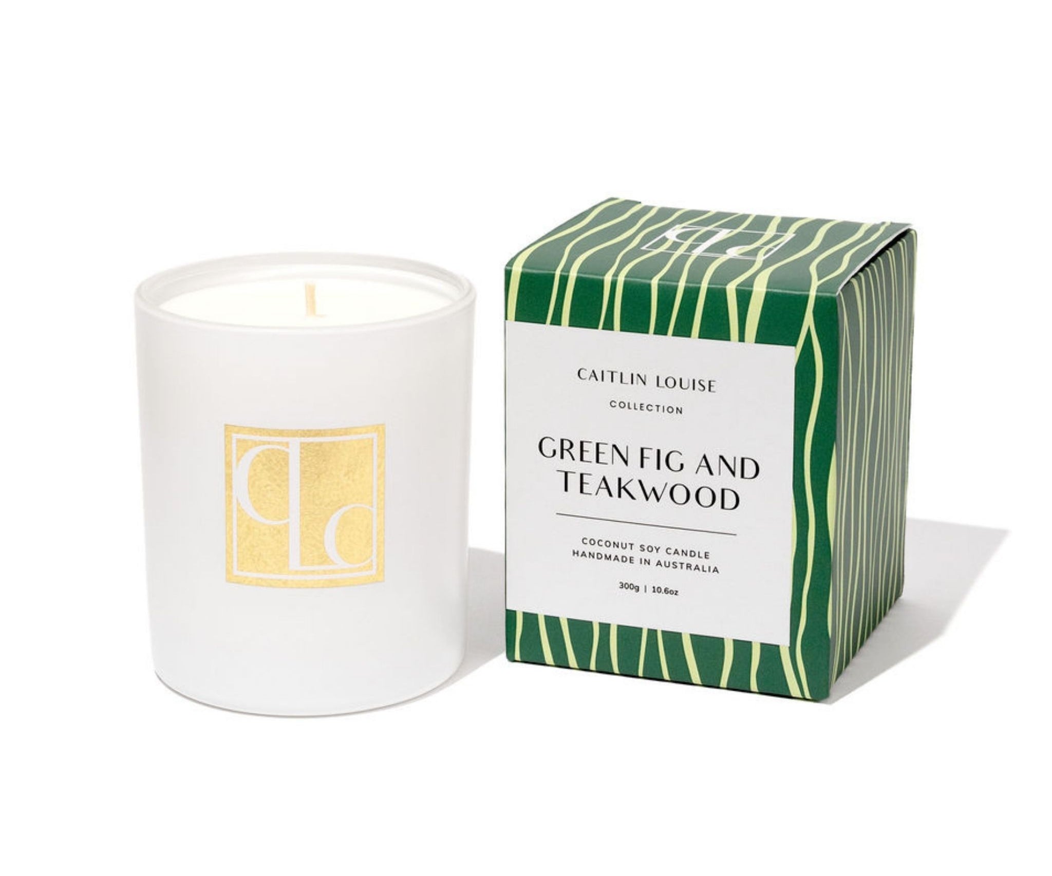 Caitlin Louise Collection candle with a green and white box labeled 'Green Fig and Teakwood' on a white background