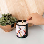 Model hand lighting Caitlin Louise Collection Jasmine Bergamot and Sandalwood Artist Candle