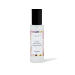 Room spray bottle with colorful label on a white background