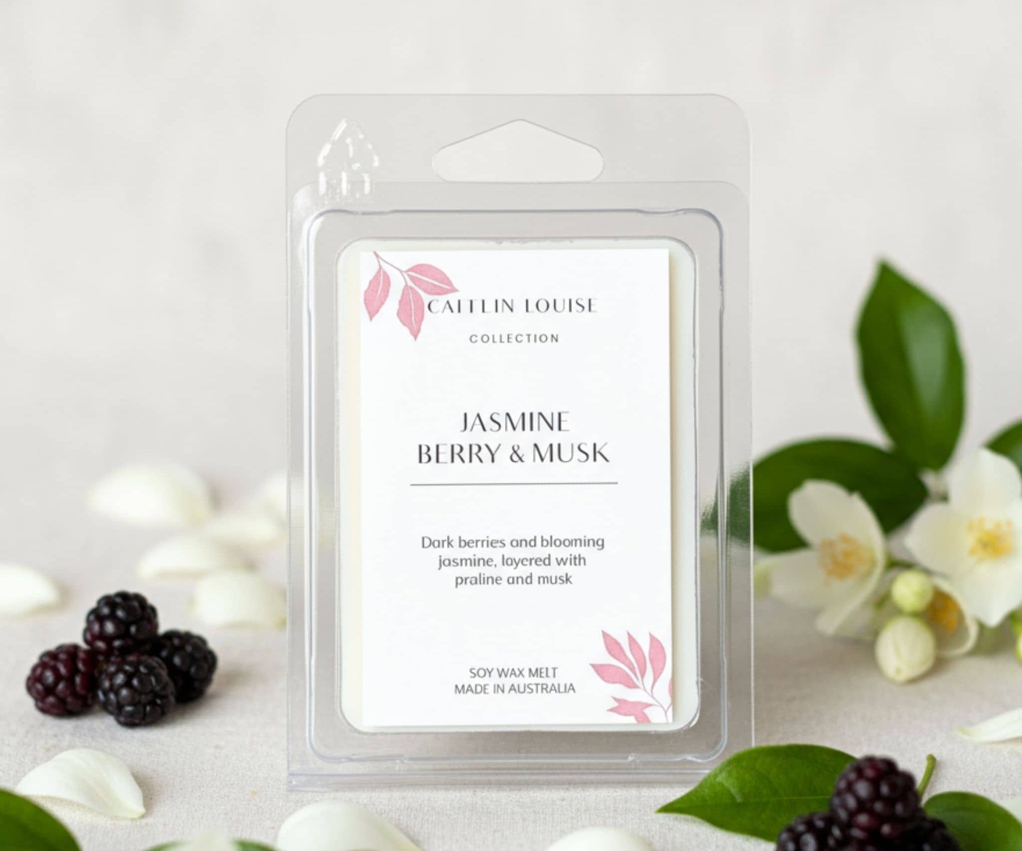 Caulin Louise Jasmine Berry & Musk wax melt packaging with berries and flowers on a light background