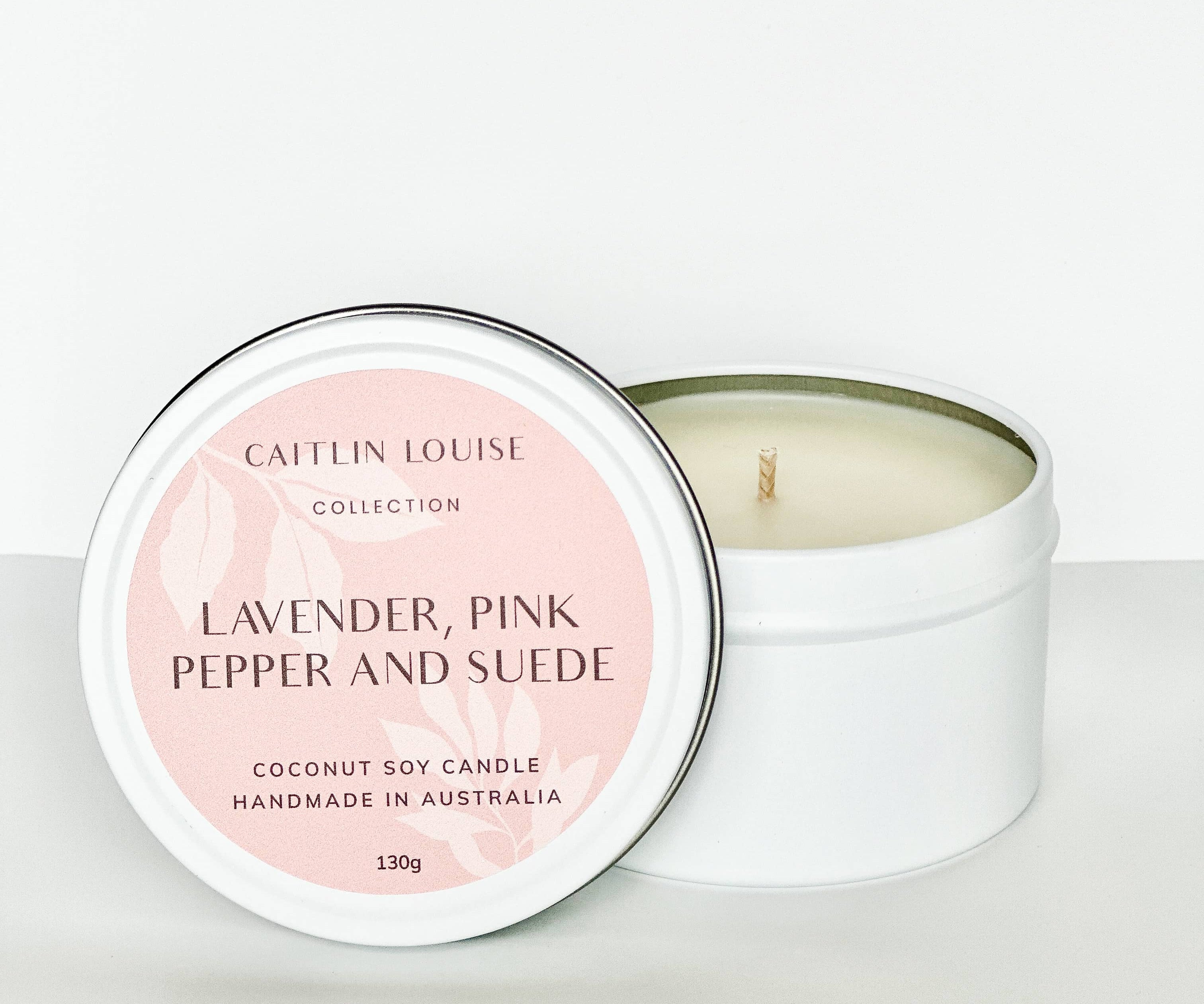 Lavender pink pepper and suede travel tin candle - white background