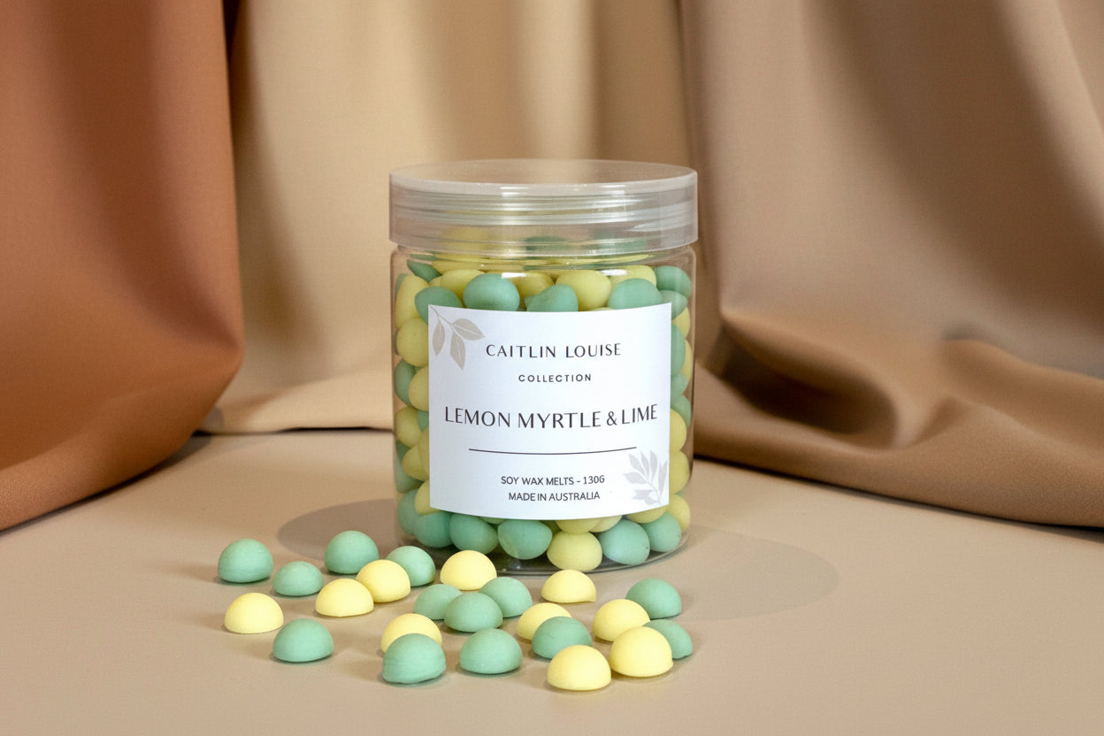 Caitlin Louise Collection's Lemon Myrtle and Lime Wax Melt pebbles in a jar.