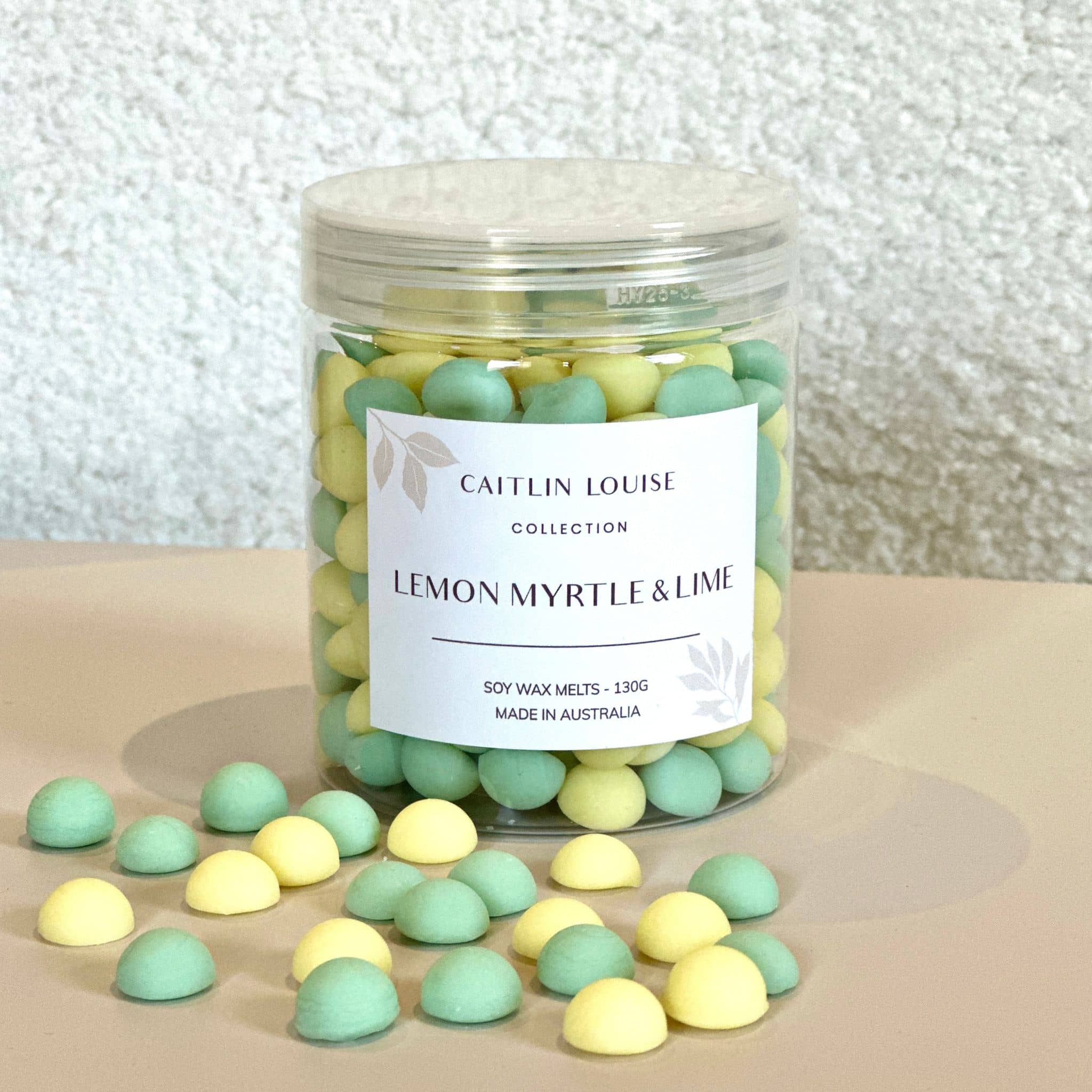 Caitlin Louise Collection's Lemon Myrtle and Lime Wax Melt pebbles in a jar.