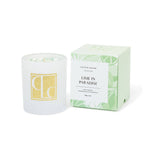 Candle with packaging labeled 'Lime in Paradise' by Caitlin Louise Collection on a white background