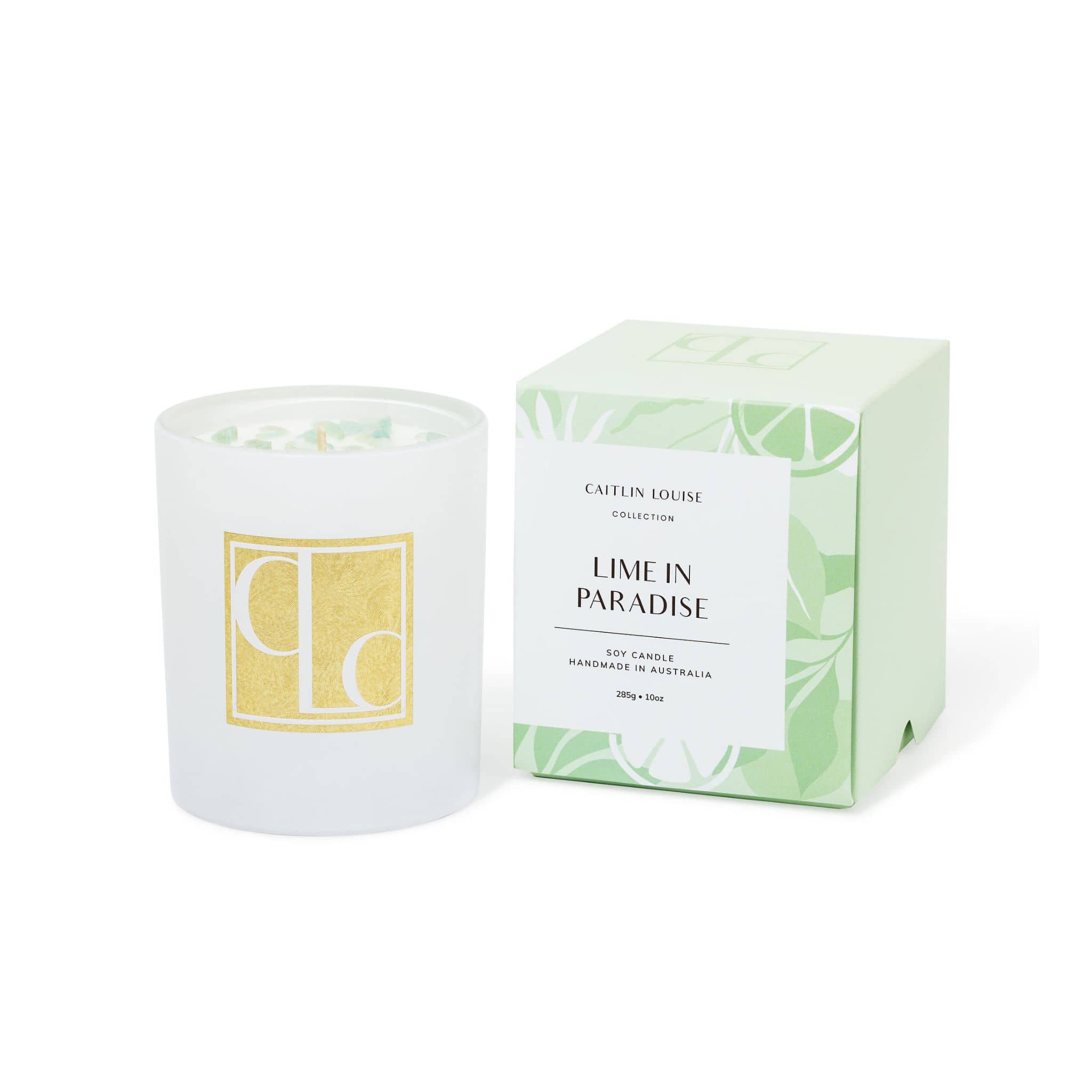 Candle with packaging labeled 'Lime in Paradise' by Caitlin Louise Collection on a white background