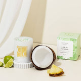 Lime coconut Candle with fresh coconut and pineapple on a neutral background
