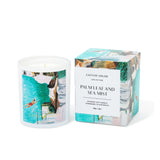 Candle with packaging labeled 'Palm Leaf and Sea Mist' by Catein Louise on a white background