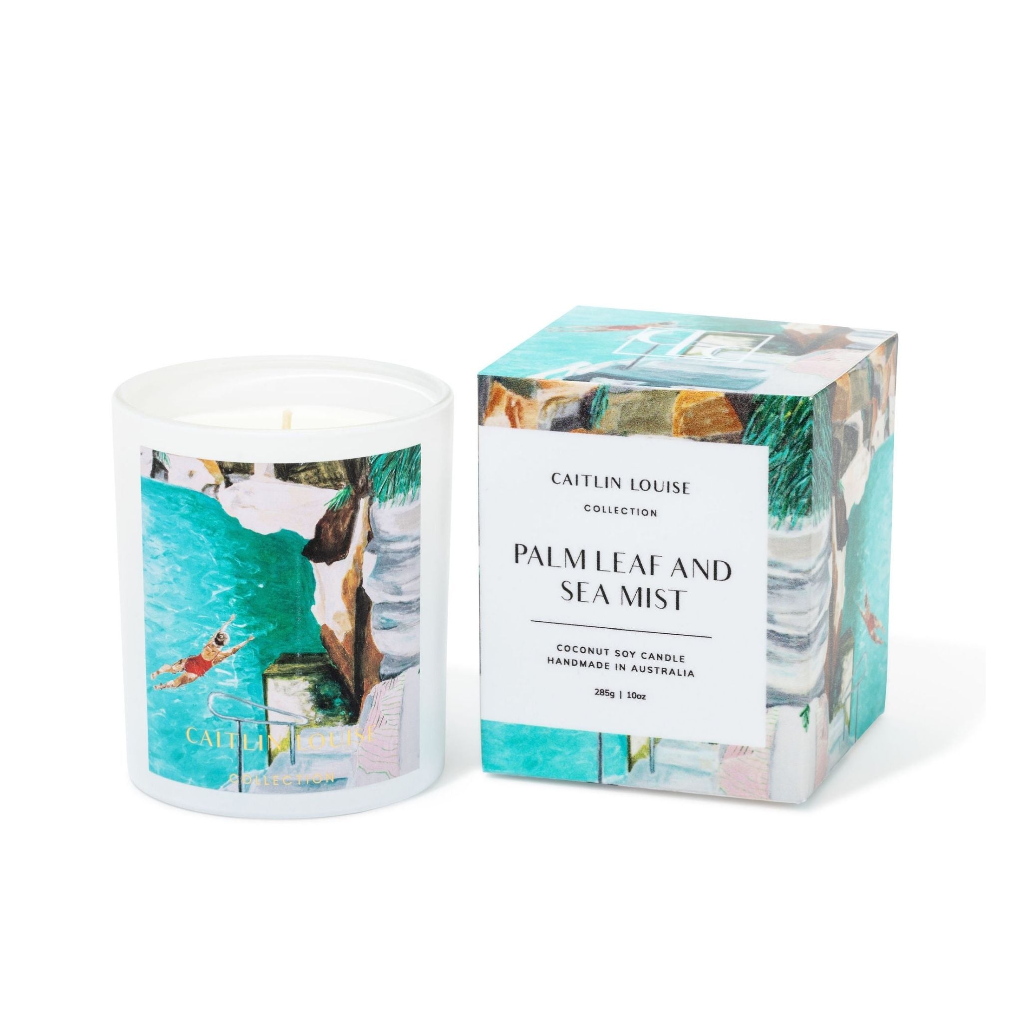 Candle with packaging labeled 'Palm Leaf and Sea Mist' by Catein Louise on a white background