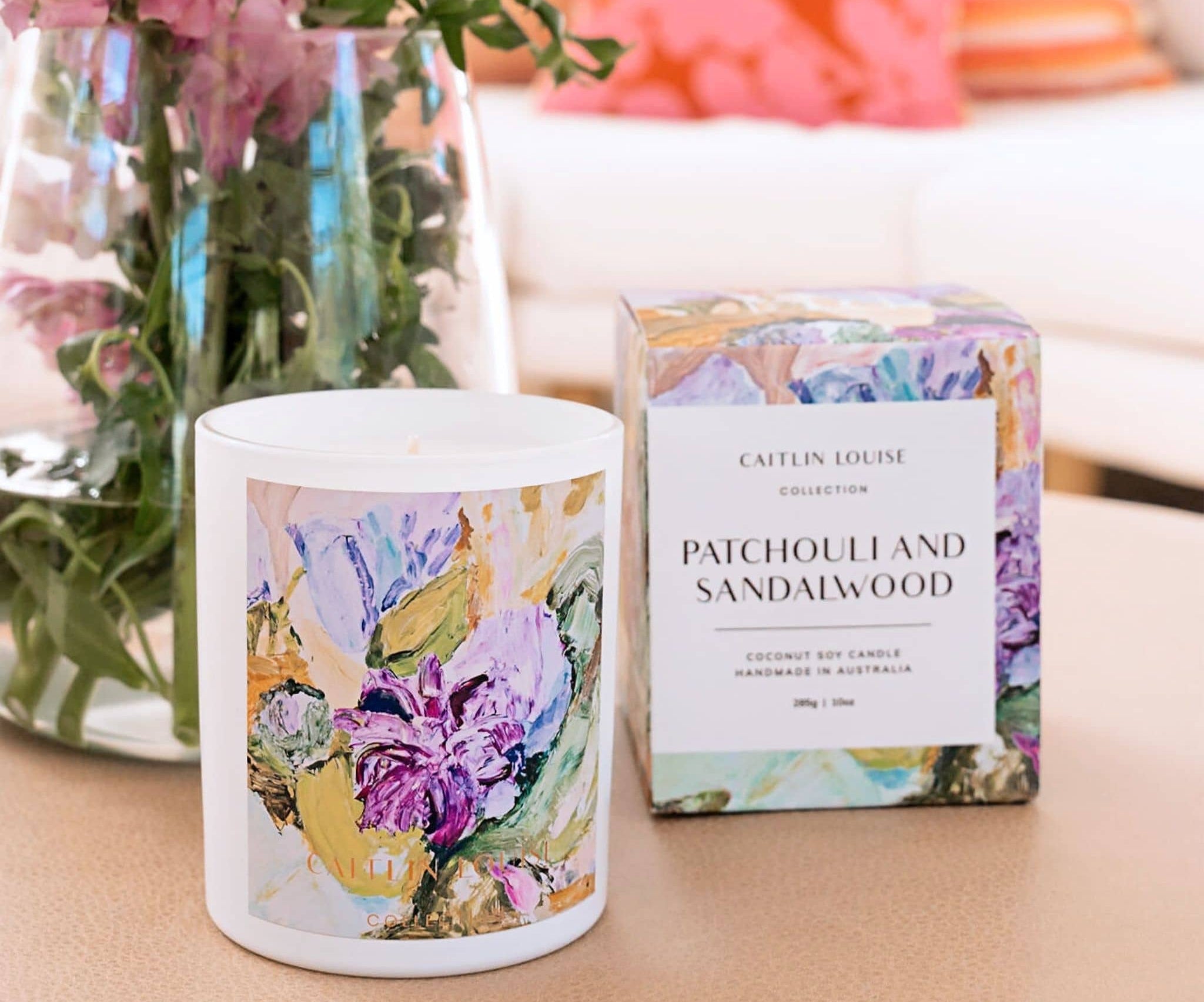 Caitlin Louise Collection Patchouli and Sandalwood Annie Everingham Artist Candle- styled with flowers