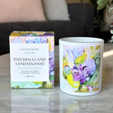 Patchouli and sandalwood artist candle with box on coffee table