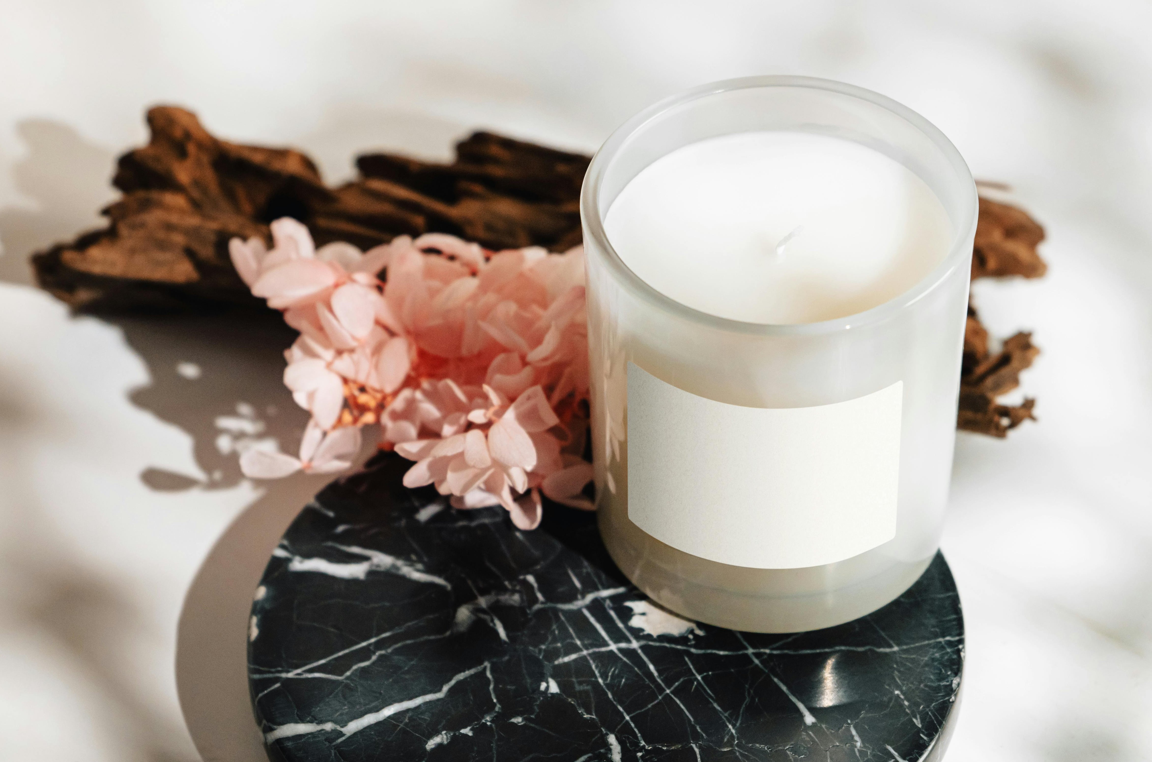 Caitlin Louise Collection private label candle service - candle on marble tray