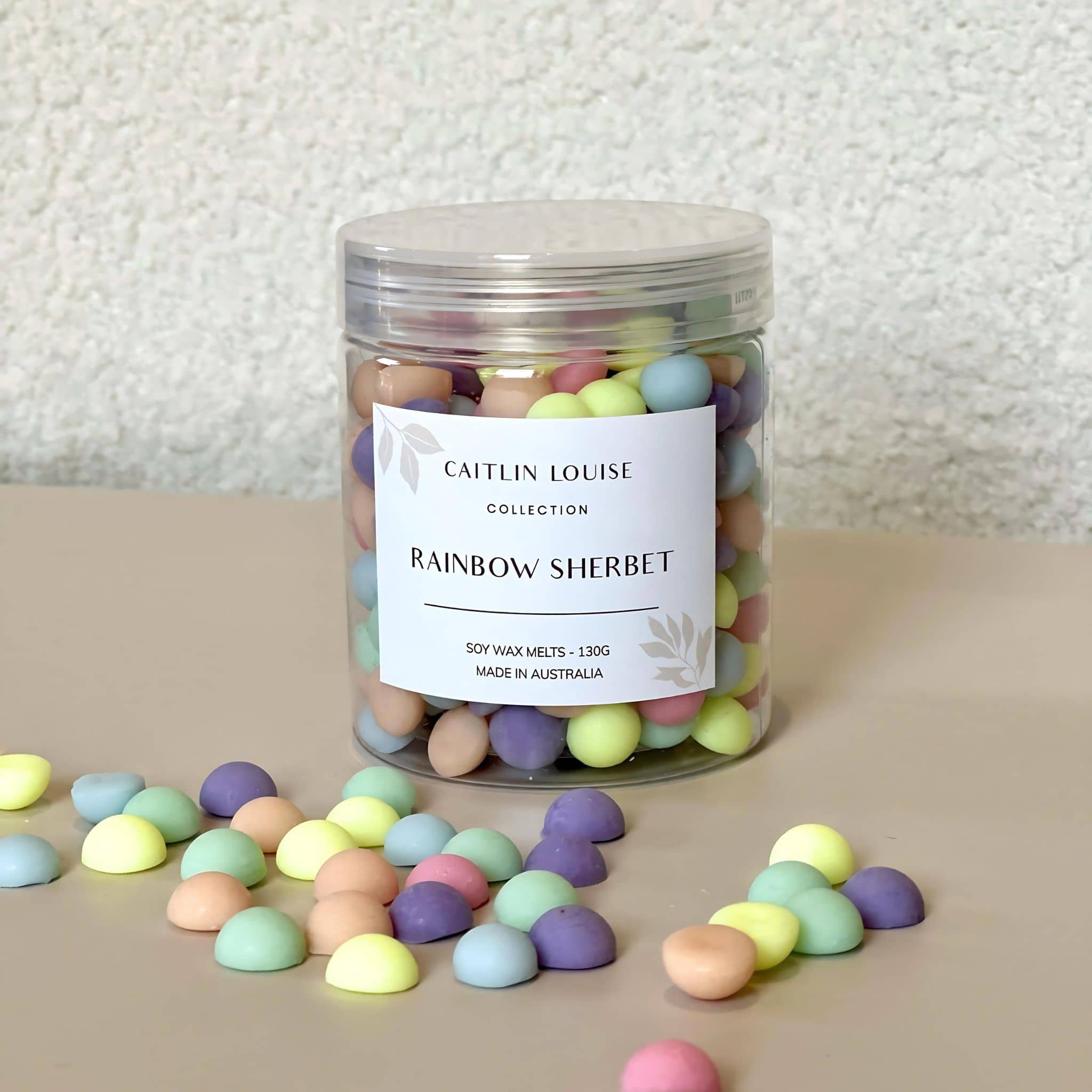 Caitlin Louise Collection's Rainbow Sherbet Soy Wax Melt Pebbles - white background - tan base