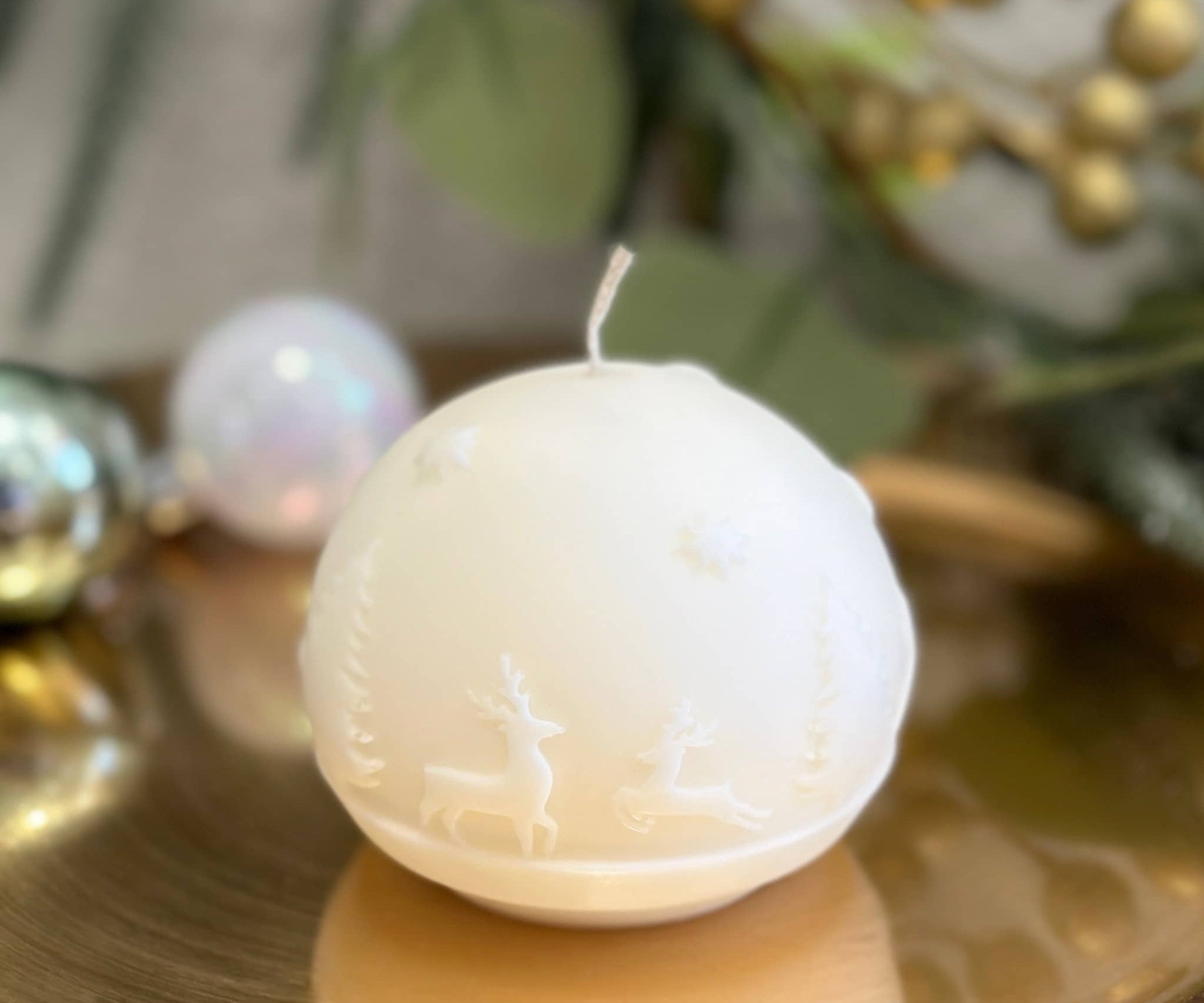 Caitlin Louise Collection Reindeer Sphere Sculptural candle - on gold tray - wreath in background