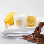 Caitlin Louise Collection Sea Salt and Driftwood Mini Candle styled on tray with lemons and driftwood - white background