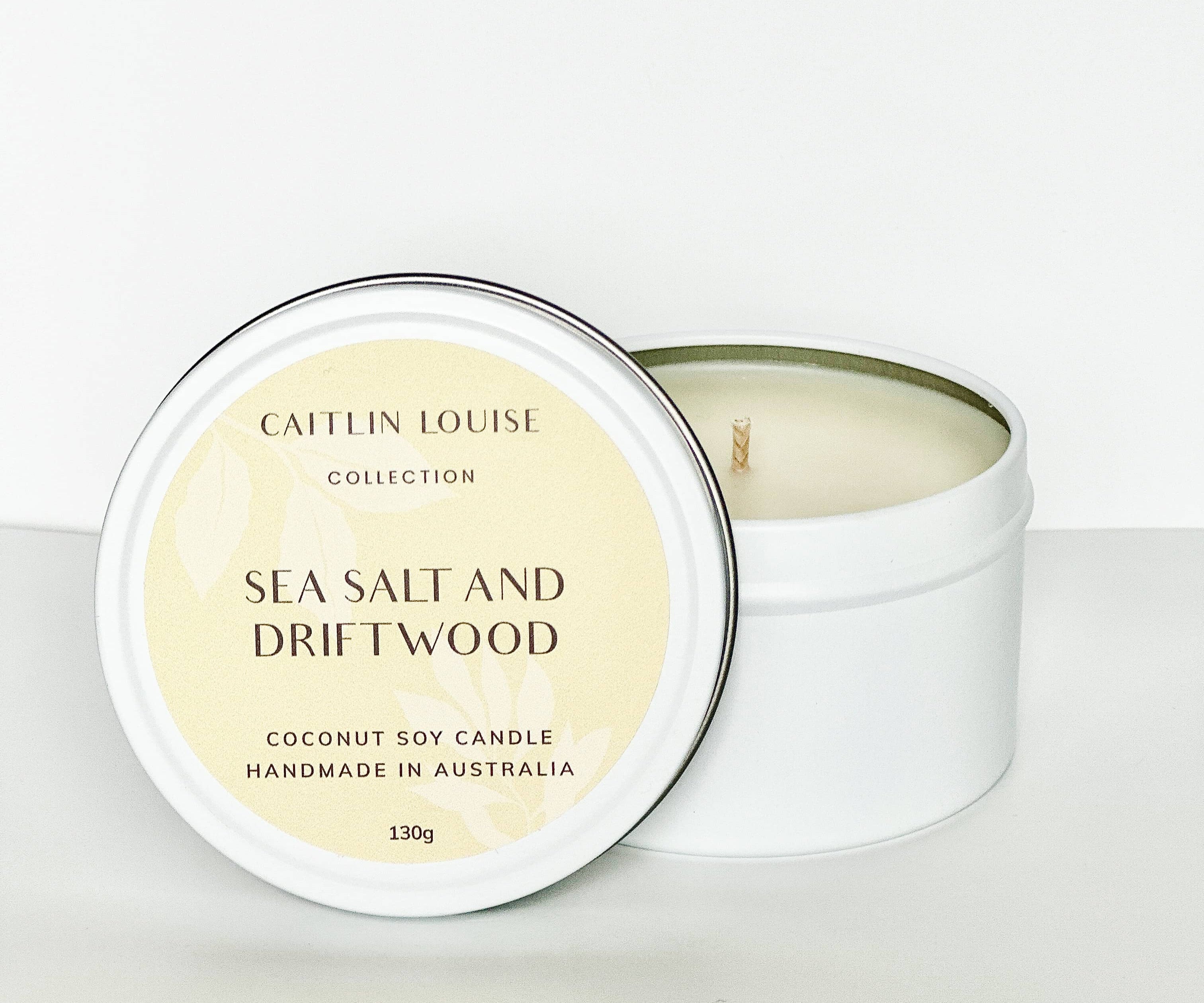 Sea salt and driftwood travel tin candle - white background