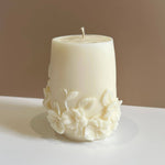 Caitlin Louise Collection Seraphina Sculptural Candle on white base - brown background