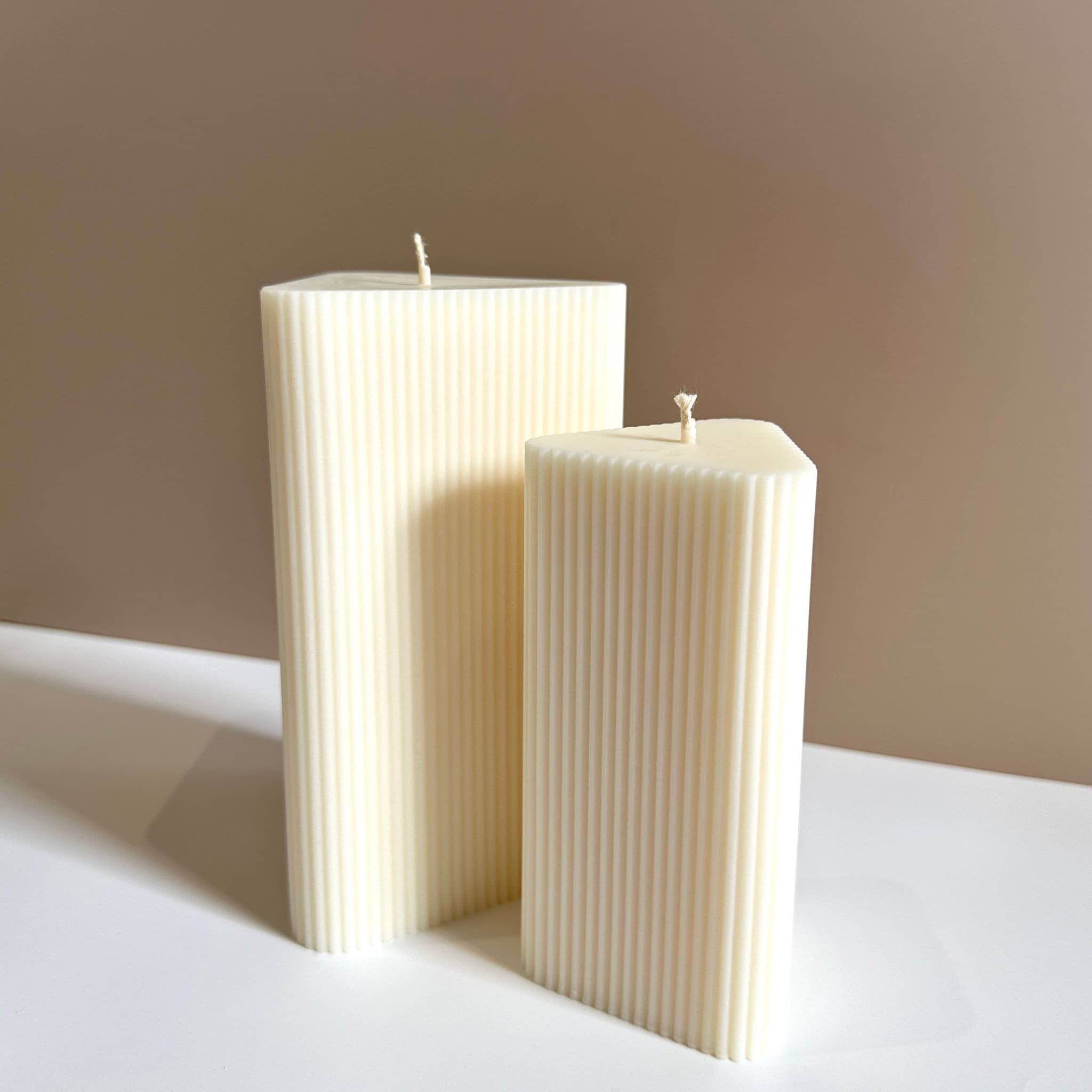 Caitlin Louise Collections small and large stria pillar candles - brown background