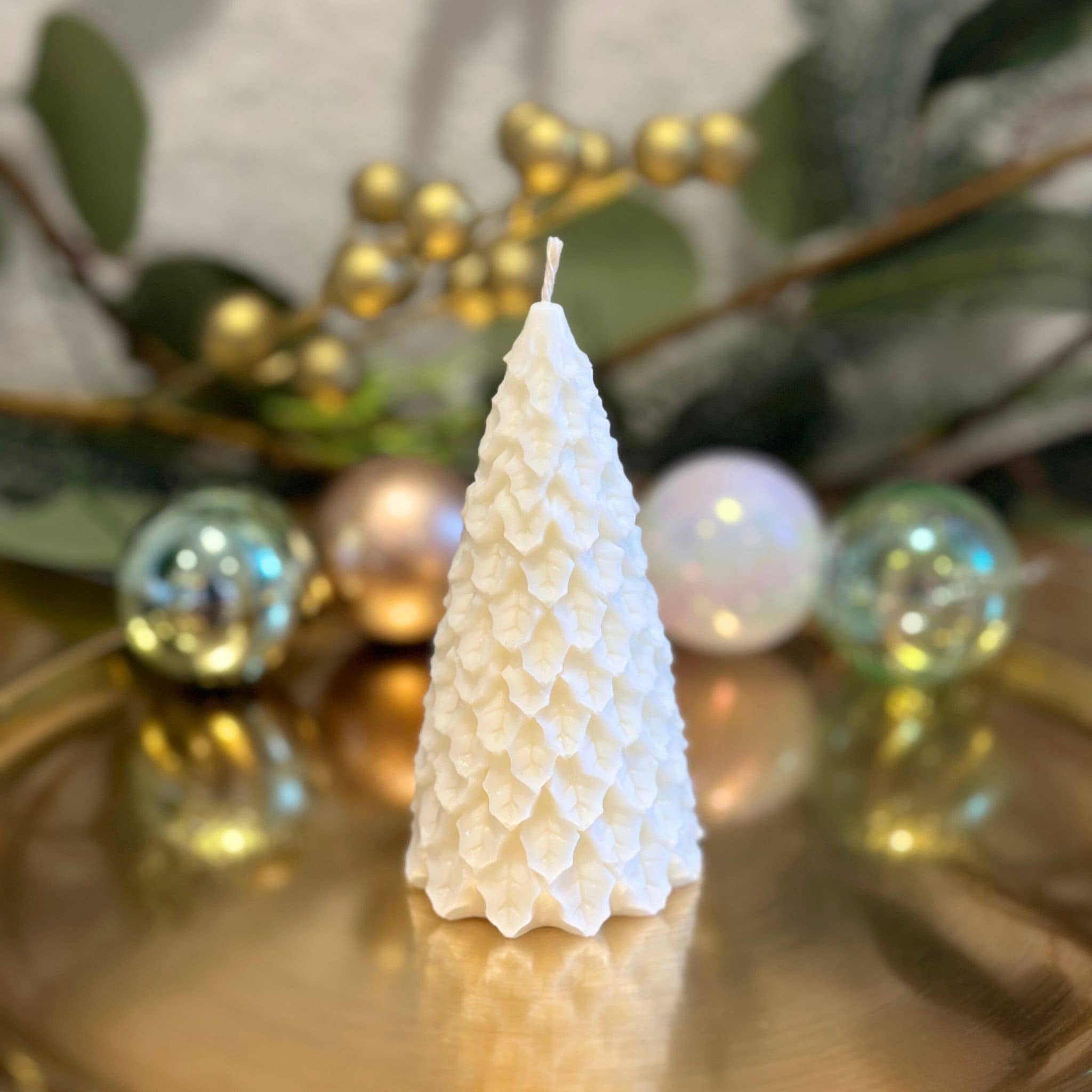 Caitlin Louise Collection tiny fir christmas tree sculptural candle - on gold plate with wreath in background