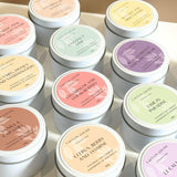 Travel tin scented candles assorted - on white table