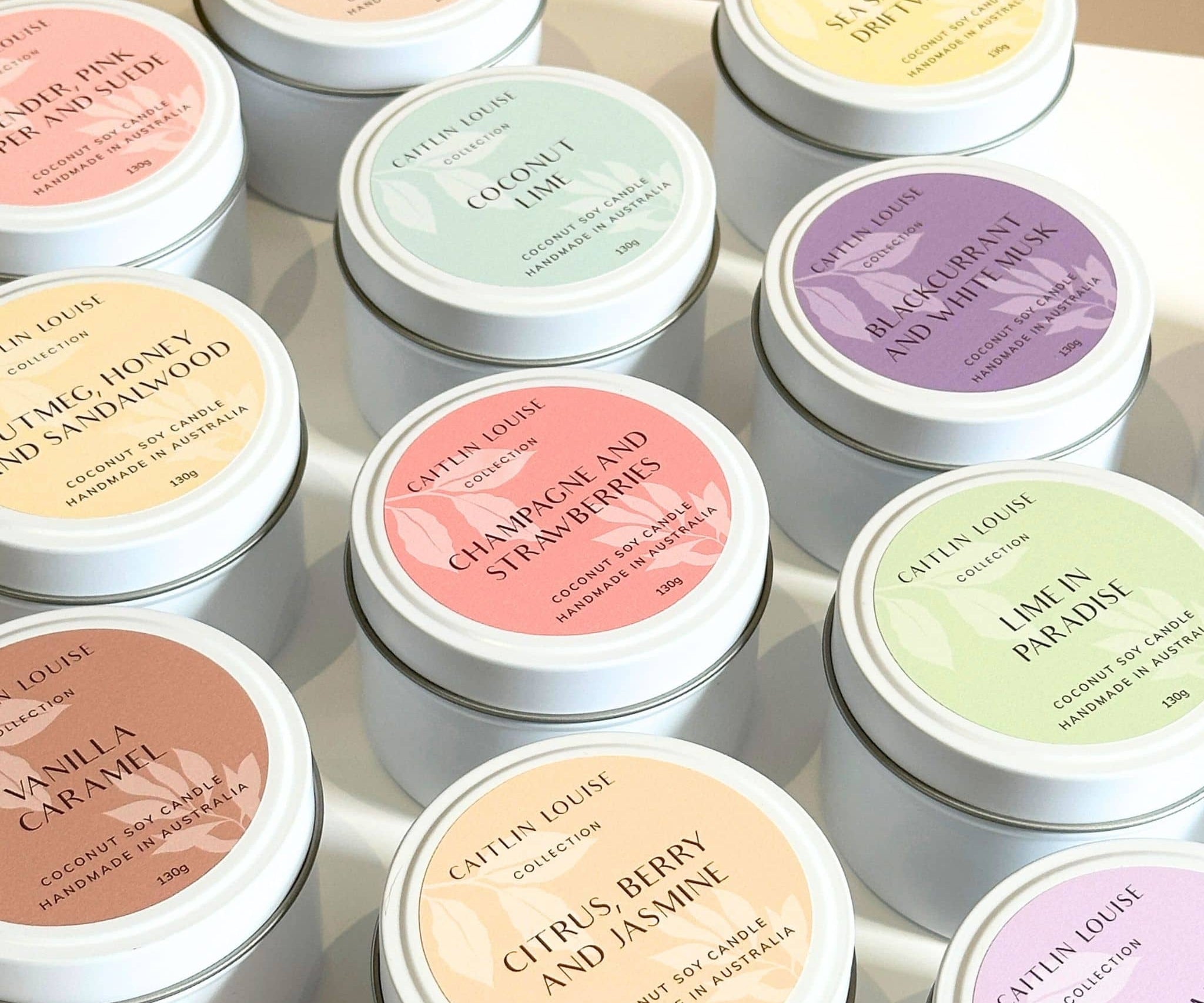Travel tin scented candles assorted - on white table