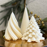 Caitlin Louise Collection trio of Christmas Tree Pillar candles - styled on gold plate with festive wreath in background.