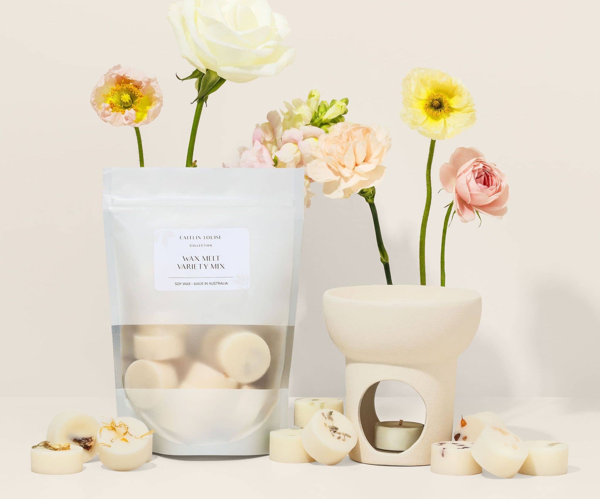 Wax melt variety pack - styled with wax melter and flowers - beige background