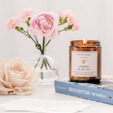 Caitlin Louise Collection Whispers of the Ton Bookish Candle - styled with flowers and Bridgerton book