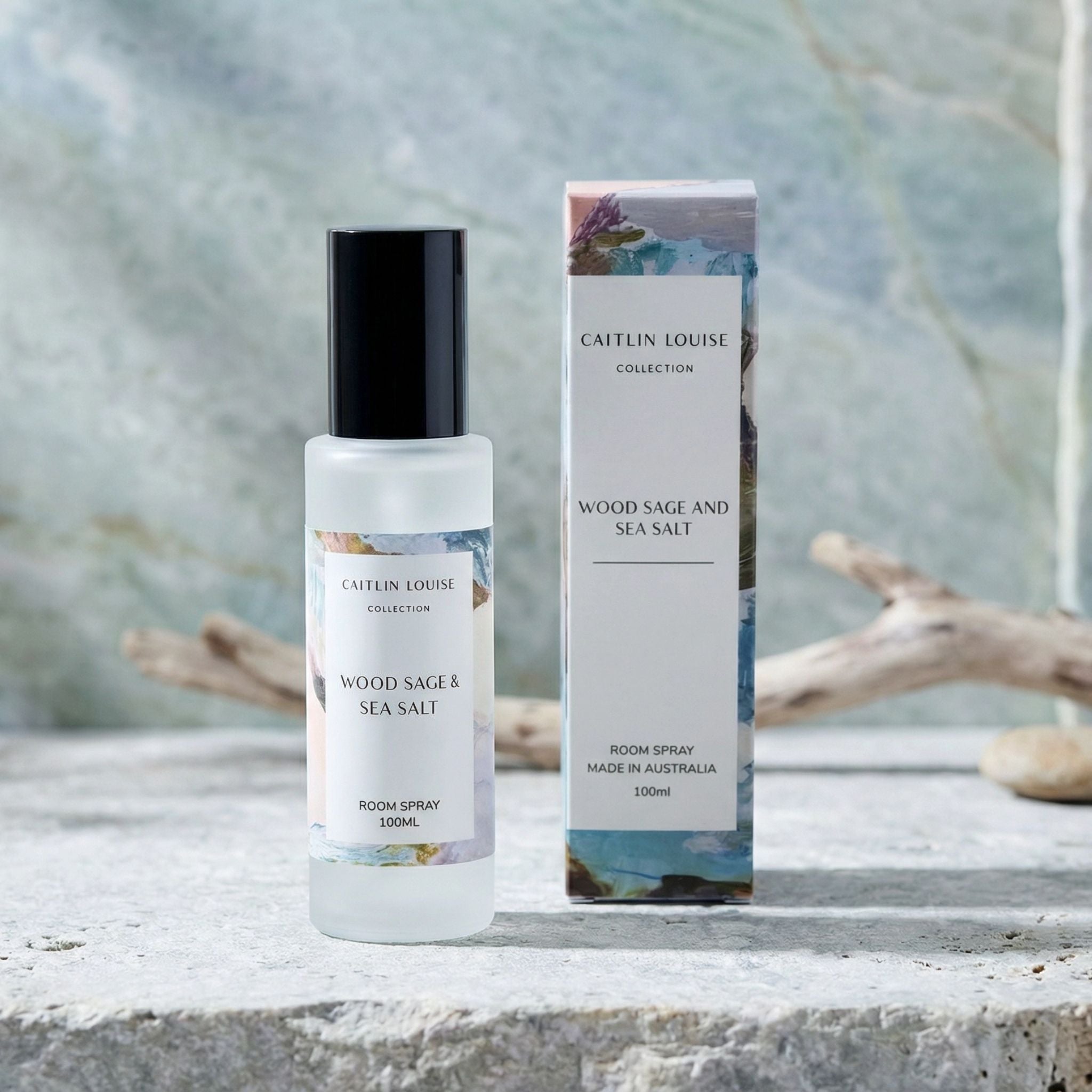 Room spray bottle and packaging with 'Caitlin Louise' branding on a natural background.
