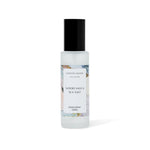 Room spray bottle labeled 'Wood Sage & Sea Salt' by Caitlin Louise Collection on a white background
