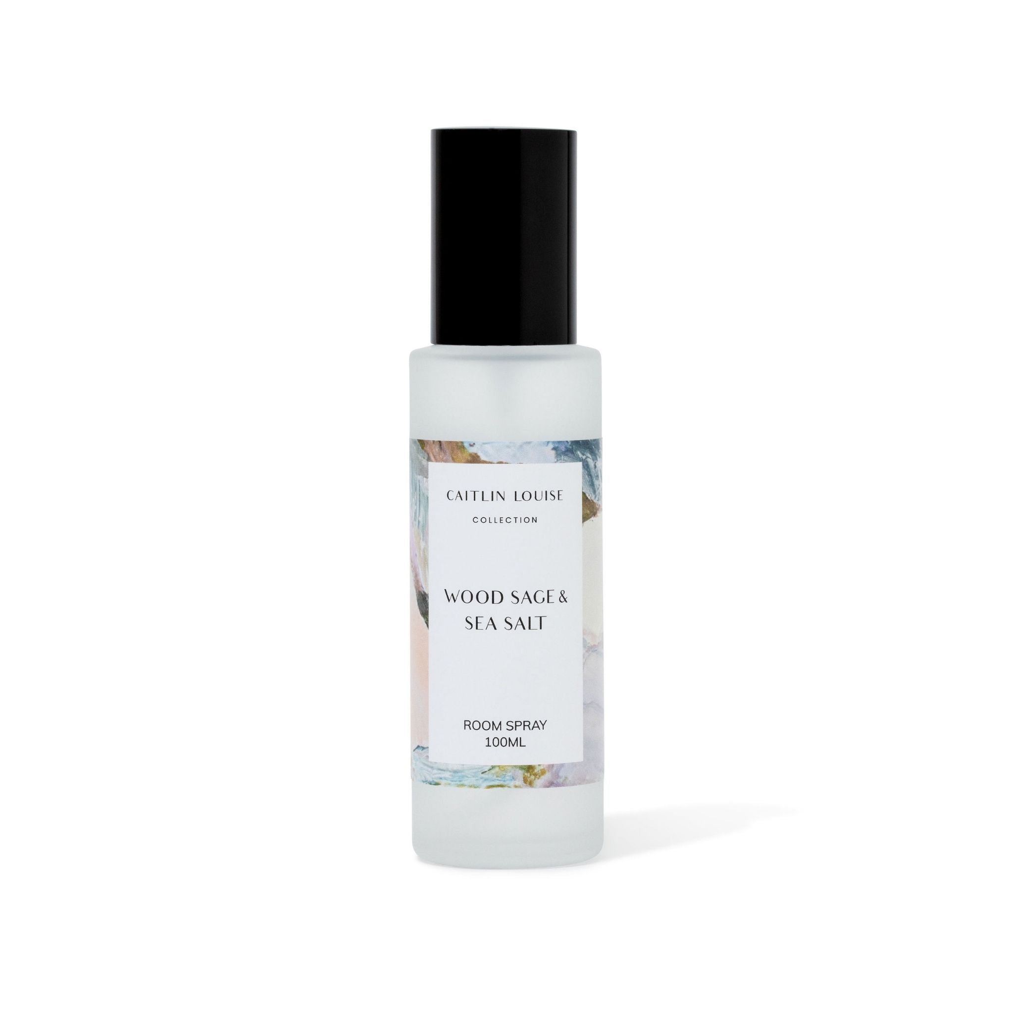 Room spray bottle labeled 'Wood Sage & Sea Salt' by Caitlin Louise Collection on a white background
