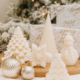 Caitlin Louise Collection's christmas decorative sculptural candles - styled with christmas tree background